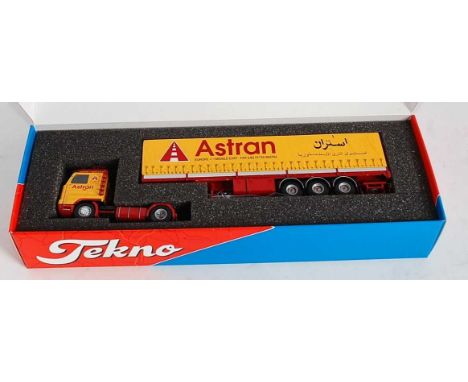 A Tekno 1/50 scale model of an Astran Europe to Middle East model of a Scania 143 tractor unit with classic tilt trailer, lim
