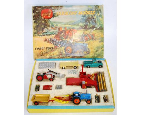 A Corgi Toys gift set No. 22 farming models to include various farm vehicles and accessories, appears complete, and housed in