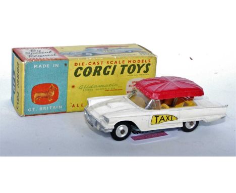 A Corgi Toys No. 430 Bermuda Taxi comprising of white body with yellow interior and unusual all-red plastic canopy with Taxi 