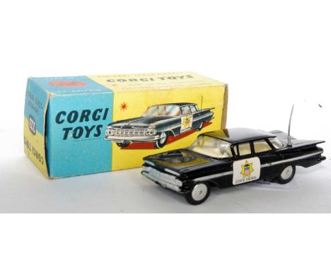 A Corgi Toys No. 223 Chevrolet State Patrol Police car, comprising black body with silver side flash and cream interior, fitt