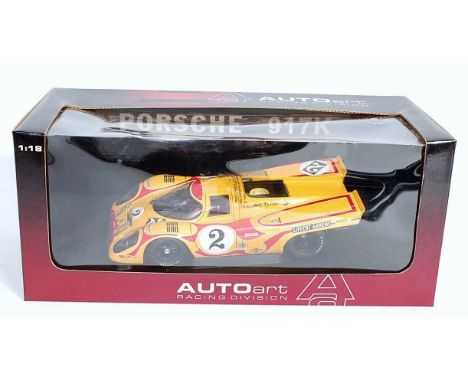 An Auto Art model No. 80035 1/18 scale model of a Porsche 917K race car from 1970 Martini Kyaimi, finished in yellow with rac