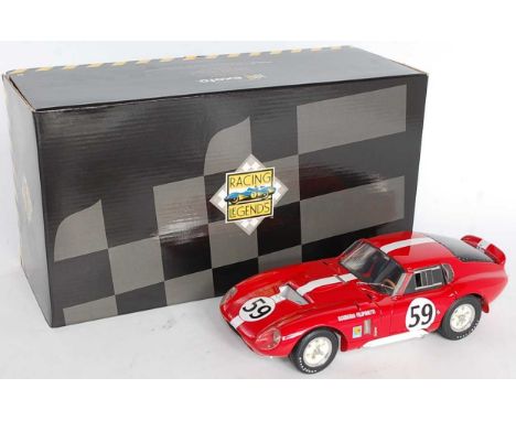 An Exoto Racing Legends 1/18 scale model of a Cobra Daytona Coupe finished in red with racing No. 59, Le Mans 1965, Sutcliffe