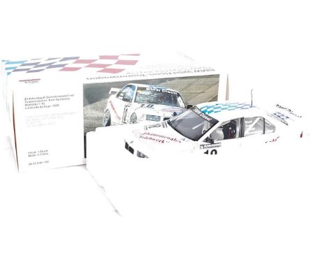 A UT Models 1/18 scale model of a BMW 320d Motorsport Racing Car, appears as issued in the original BMW branded polystyrene p