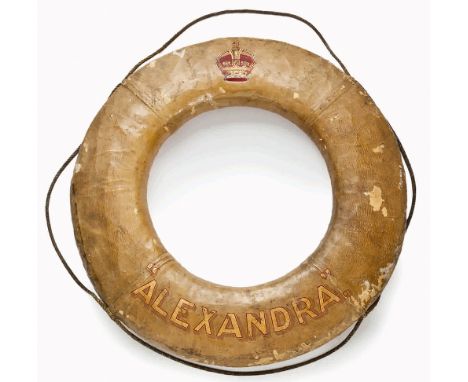 A LIFEBUOY FROM THE R.Y. ALEXANDRA (1908)
cork-filled canvas painted white with polychromed crown and inscribed in gilt lette
