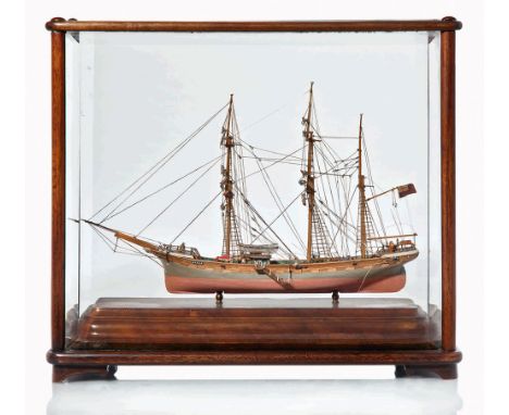 A WELL-PRESENTED MODEL OF THE BARQUE MANILA, CIRCA 1880
with carved hull finished in grey and pink with varnished topsides, s