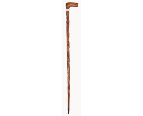 A WALKING STICK CARVED FROM TIMBER RECOVERED FROM THE WRECK OF THE ROYAL CHARTER [1859]
of tapering form carved with foliate 