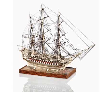 Ø AN EARLY 19TH-CENTURY NAPOLEONIC FRENCH PRISONER-OF-WAR BONE AND BALEEN MODEL FOR A 64-GUN SHIP
with 8in. planked and pinne