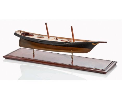 AN ATTRACTIVE UN-RIGGED MODEL OF THE FAMOUS RACING YACHT AMERICA (1851), PROBABLY LATE 19TH-CENTURY
the 25½in. hull carved fr