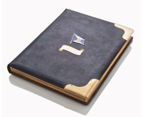 A SILVER-GILT AND ENAMEL MOUNTED PRESENTATION ALBUM FOR THE MAIDEN VOYAGE OF THE  HAMBURG-AMERIKA LINE'S S.S. AMERIKA, 1905
t