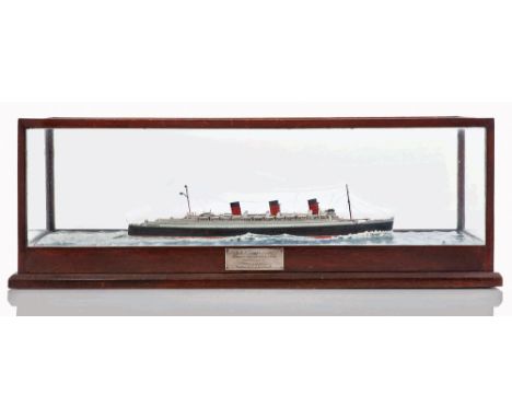 A SCALE WATERLINE MODEL OF THE R.M.S. QUEEN MARY, CIRCA 1937
carved and painted in Cunard livery with detailed superstructure