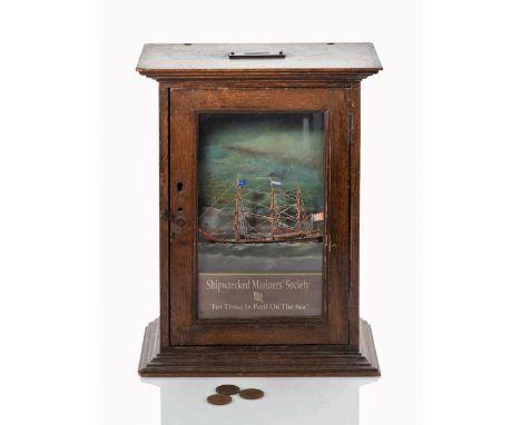 A RARE ROCKING AUTOMATON COLLECTION BOX FOR THE SHIPWRECKED MARINERS' SOCIETY, CIRCA 1900
the painted tin interior with rigge