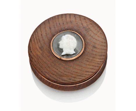 A GOLD MOUNTED SNUFF BOX MADE FROM THE TIMBER OF H.M.S. VICTORY, EARLY 19TH-CENTURY
the lid with profile of Nelson formed of 