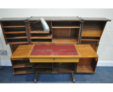 A MID-CENTURY NEWCRAFT LTD TEAK HOME OFFICE, the double doors enclosing a pull out writing surface, an arrangement of shelvin