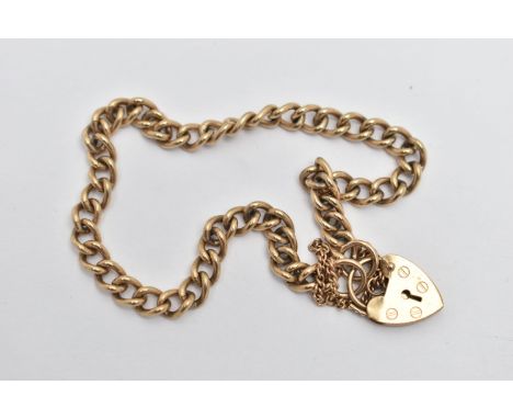 A 9CT GOLD CURB LINK BRACELET, polished curb link bracelet, fitted with a heart padlock clasp with additional safety chain, h