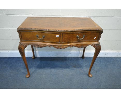 A REPRODUCTION QUEEN ANNE STYLE WALNUT SERPENTINE SIDE TABLE, with two drawers, on cabriole legs, width 105cm x depth 58cm x 