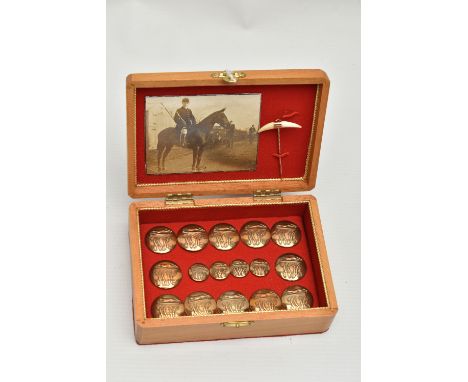 A SMALL BOXED SET OF HUNTING BUTTONS, to include twelve larger brass buttons and four smaller buttons, each depicting a fox w