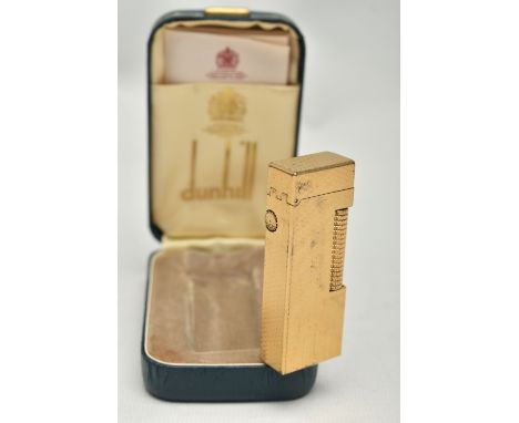 A CASED DUNHILL ROLLAGAS LIGHTER, of gold plated, engine turned design, stamped Made In Switzerland, U.S. RE24163 Patented, D
