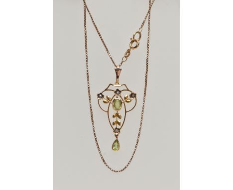 A YELLOW METAL LAVALIER PENDANT AND CHAIN, openwork pendant set with a central oval cut peridot with split pearl floral detai