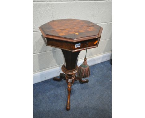 A LATE VICTORIAN WALNUT OCTAGONAL TRUMPET SEWING TABLE, with a chess board lid, that's enclosing a fitted interior, on tripod