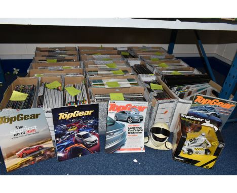 TWENTY FOUR BOXES OF BBC TOP GEAR MAGAZINES, to include a boxed 27MHZ radio controlled racing car, a Stig alarm clock, a 30th