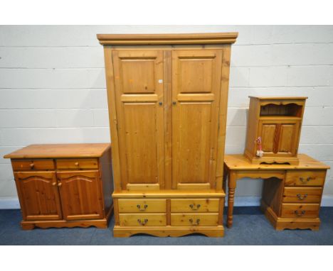 A PINE BEDROOM SUITE, comprising a double door wardrobe with four drawers, width 116cm x depth 56cm x height 196cm, a dressin