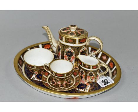 A MINIATURE ROYAL CROWN DERBY IMARI 1128 TEA SET AND SERVING TRAY, comprising on oval serving tray, length 20cm x width 16cm,