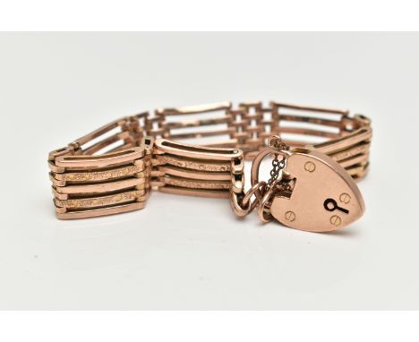 A ROSE METAL BRACELET WITH PADLOCK CLASP, five bar bracelet, some polished and some textured bars, stamped to the reverse 9c,