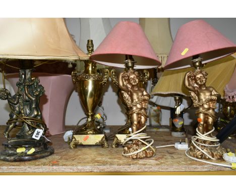 EIGHT TABLE LAMPS AND A COLLECTION OF SHADES, comprising three onyx and brass table lamps, a pair of gilt figural lamps, a pa