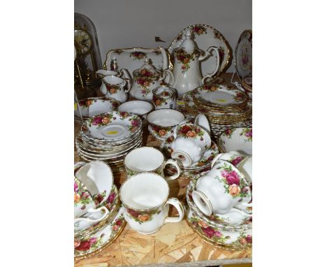 A SIXTY THREE PIECE ROYAL ALBERT 'OLD COUNTRY ROSES' DINNER SERVICE, comprising a teapot, a coffee pot, two cream jugs, two s