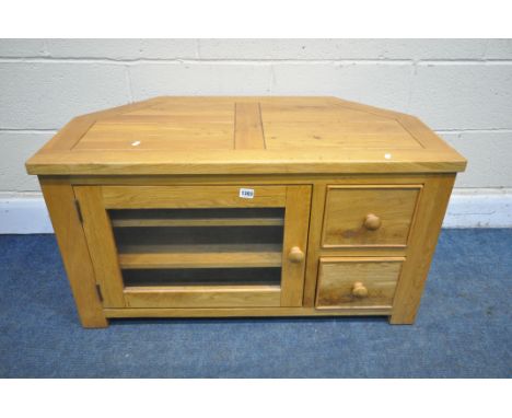 A LIGHT OAK CORNER TV STAND, with a single glazed door and two drawers, width 95cm x depth 50cm x height 50cm