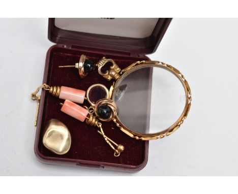 A DOUBLE PHOTO LOCKET, A GOLD TOOTH AND TWO PAIRS OF EARRINGS, double glass photo locket of a circular form, collet and twist