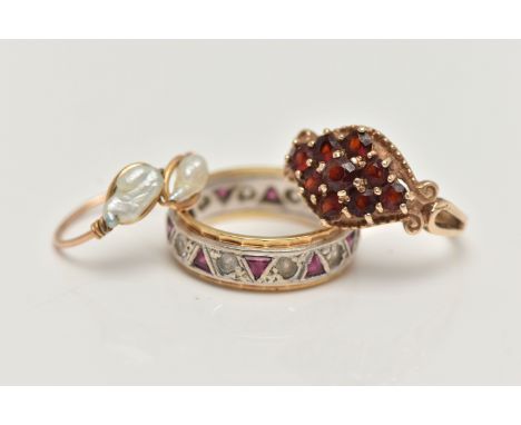 THREE RINGS, to include a 9ct gold garnet cluster ring, of a marquise form, bead and scroll work surround, to the bifurcated 