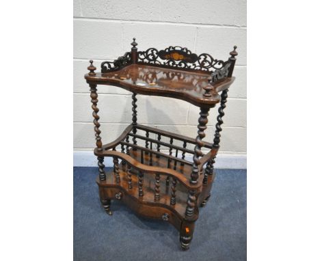 A VICTORIAN ROSEWOOD SERPENTINE CANTERBURY, the raised shelf with open fretwork gallery, on barley twist supports, three divi