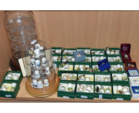 A COLLECTION OF THIMBLES WITH DISPLAY CASES, to include over seventy thimbles, mainly Thimble Collectors Club 'Birds of Brita