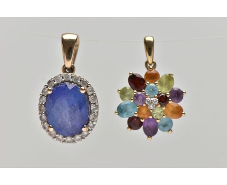 TWO 9CT GOLD GEM SET PENDANTS, the first an oval cluster designed with a four claw set oval cut tanzanite in a surround of co