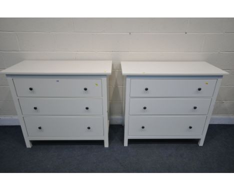 A PAIR OF WHITE FINISH IKEA CHEST OF THREE LONG DRAWERS, with black handles, width 110cm x depth 51cm x height 97cm (conditio