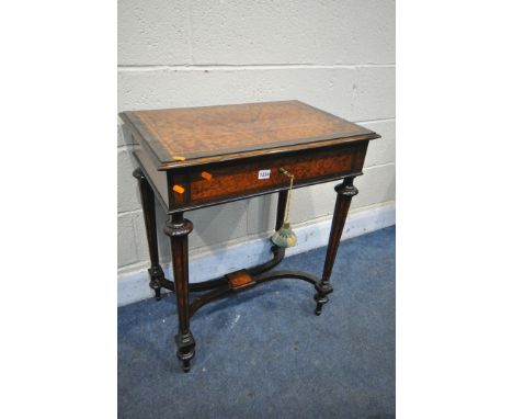 A LATE VICTORIAN MAPLE, ROSEWOOD AND MAHOGANY WORK TABLE, with a hinged lid, pink fabric to inner lid, single drawer, on tape