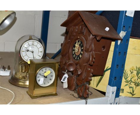 A WEST GERMAN CUCKOO CLOCK, together with a London Clock Co. quartz carriage clock (battery operated) and a Koma glass domed 