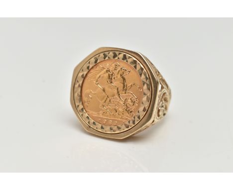 A 9CT GOLD HALF SOVEREIGN RING, half sovereign dated 1982, collet set in a textured mount, openwork scroll detailed shoulders