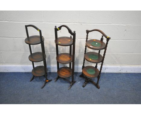 AN OAK BOBBIN TURNED THREE TIER CAKE STAND, and two oak folding cake stand, max height 89cm (condition:-felt lifting, one han