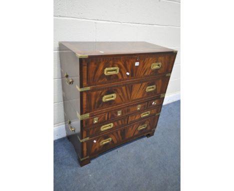 A MAHOGANY BRASS BOUND CAMPAIGN CHEST, with an arrangement of eight drawers, with four brass drop handles, on bracket feet, w