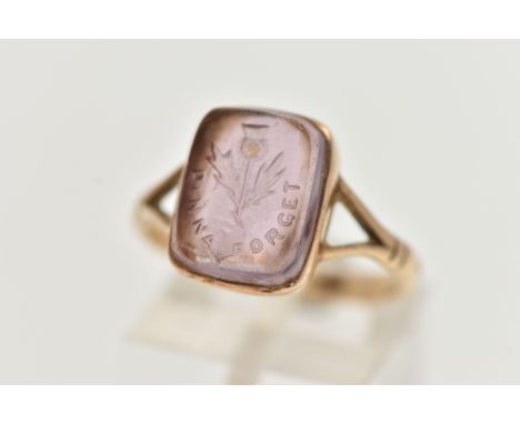 A YELLOW METAL INTAGLIO RING, purple paste intaglio of a rectangular form, engraved with a thistle inscribed 'Dinna Forget' t