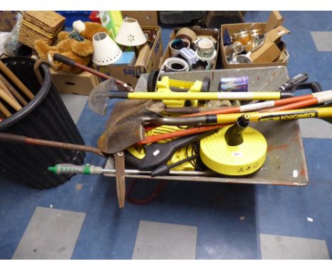 A Garden Wheelbarrow Containing Garden Tools, Pressure Washer Etc