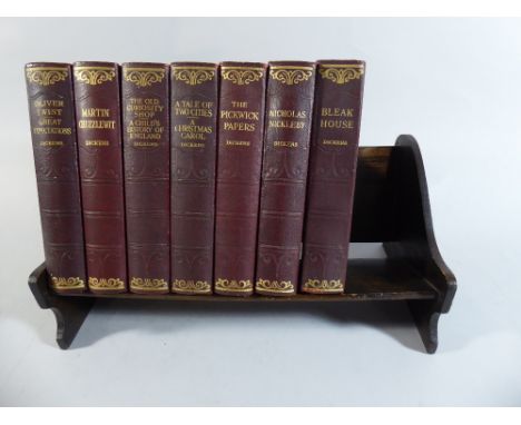 An Edwardian Oak Book Trough Containing Seven Volumes Dickens  