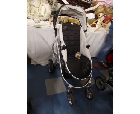 A Mamas and Pappas Pushchair with Instruction Manual and Carrycot