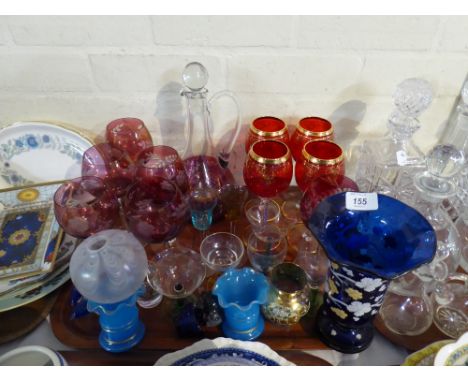 A Tray of Coloured Glass Ware to Include Claret Jug, Cranberry Wine Glasses, Ruby Wine Glasses, Blue Vases Etc
