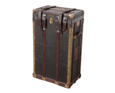 MALLE LAVOLAILLE, PARIS: A CANVAS AND LEATHER, BRASS AND WOOD-BOUND TRUNK with leather carrying straps and handles, felt inte