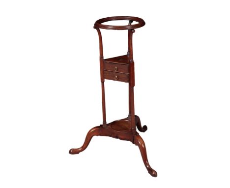 A GEORGE III STYLE MAHOGANY BASIN STAND with circular moulded ring above three turned supports and fitted two triangular draw