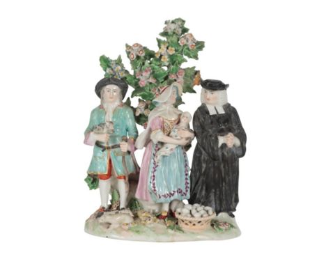 AN 18TH CENTURY DUESBURY & CO DERBY PORCELAIN FIGURE GROUP - 'THE TITHE PIG' 18cm high, patch marked base (3)