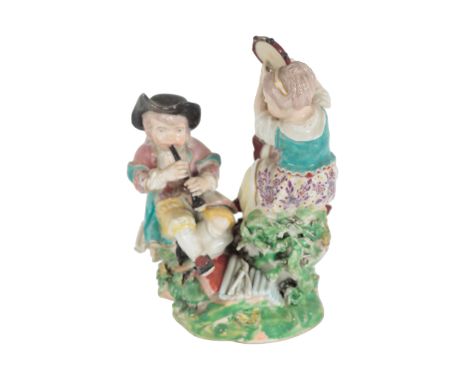AN 18TH CENTURY DUESBURY &amp; CO DERBY PORCELAIN FIGURE - CHILD MUSICIANS modelled as a boy and girl seated on rustic base, 